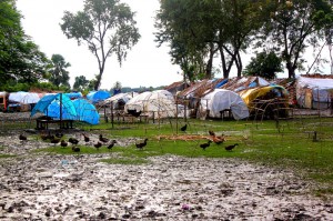 Image of tents on sodden ground